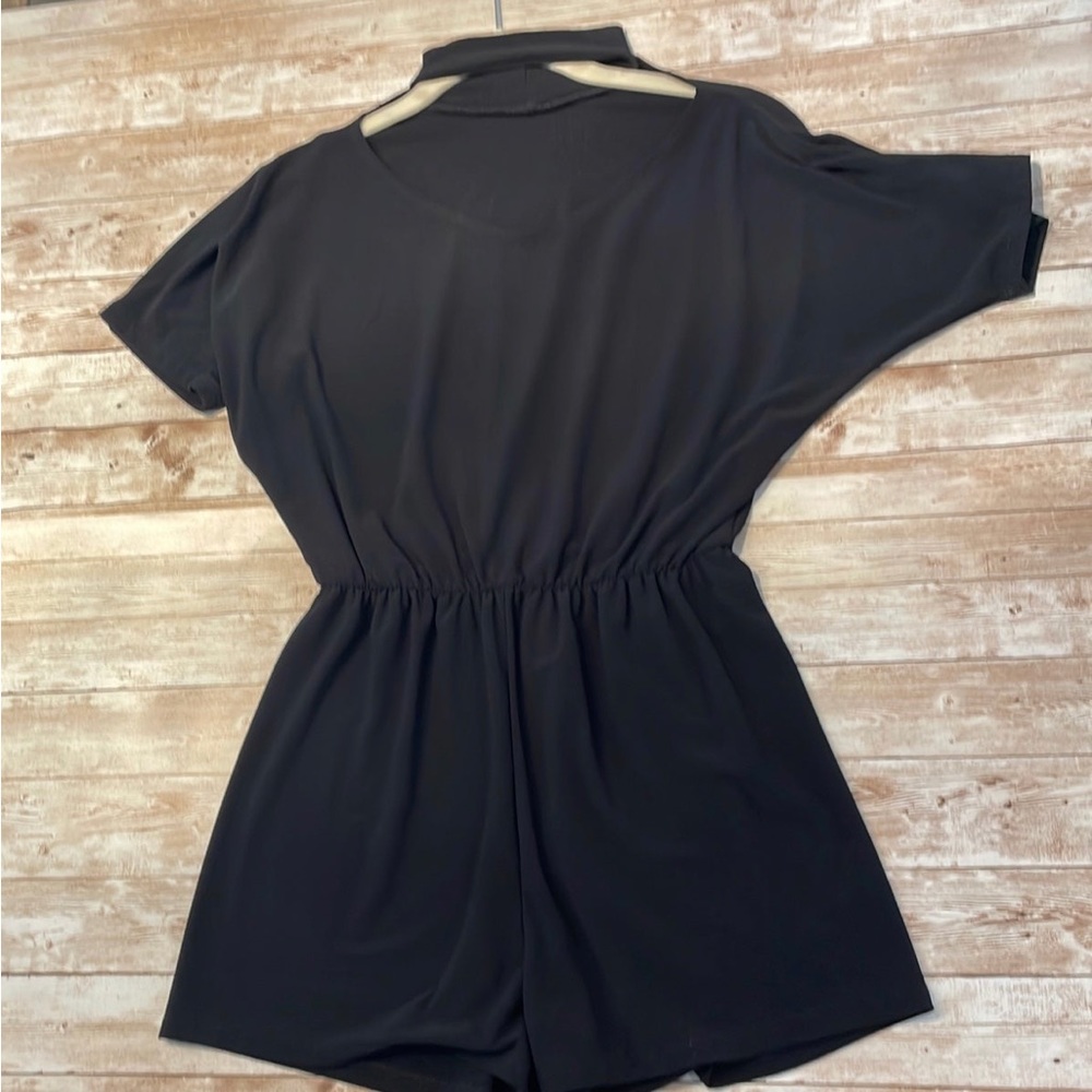 Girls Black Romper. Beautiful neck detail.